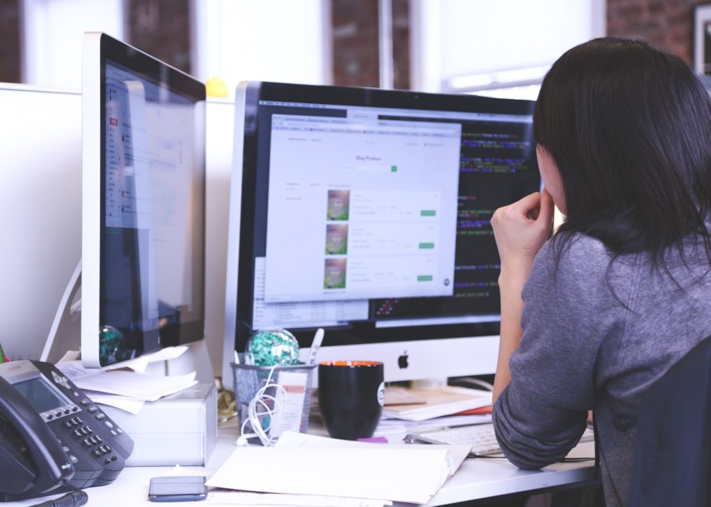 Facility managers researching and selecting CMMS software for optimized facility management.